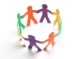 Colorful cut-outs of children holding hands in circle (graphic)